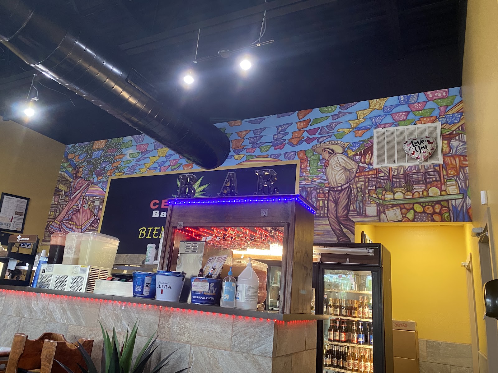 Colorful mural and bar area inside Cerrito Bar & Grill